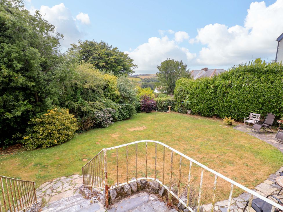 A garden area with grass and seating at 3 Chantry Hill in Kingsbridge