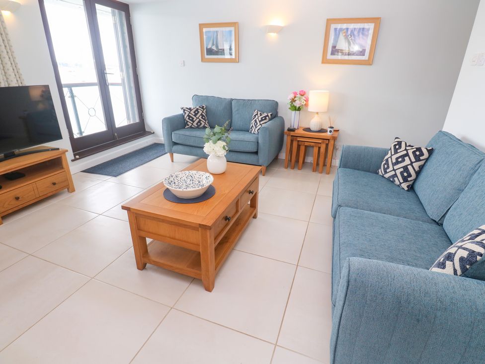 A living room with sofas and a coffee table at Tobys Quay in Falmouth