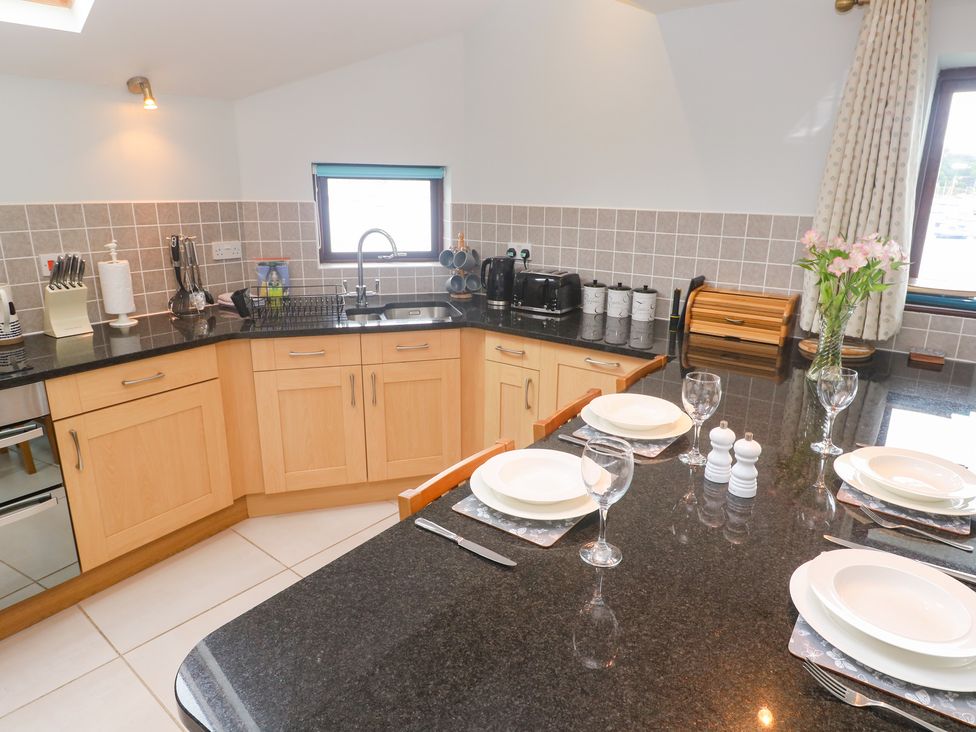 A kitchen with countertops and utensils at Tobys Quay in Falmouth