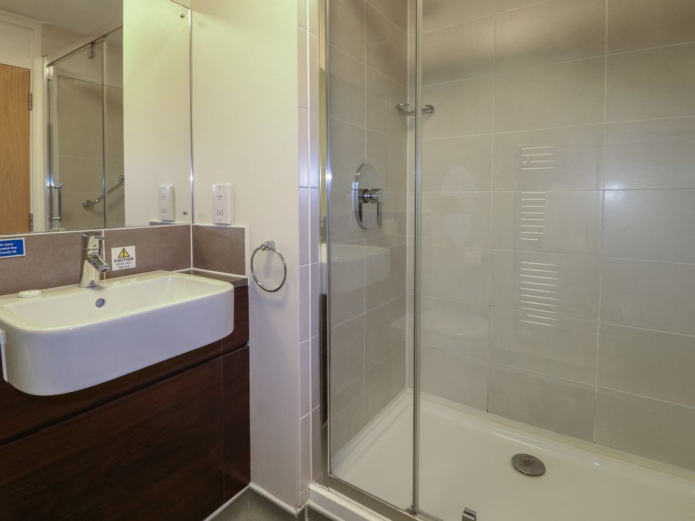 A bathroom with a sink and shower at Flat 2 in Littlehampton