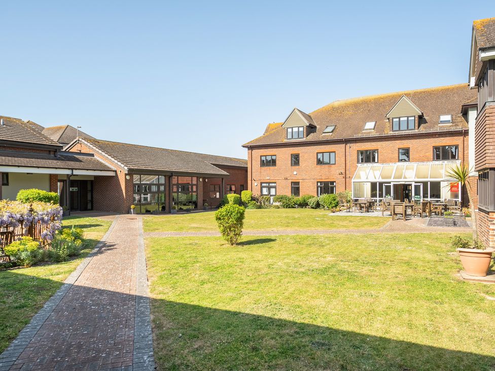 An outdoor area with buildings and seating at Marine Court First-floor Apartment with Shower Room in Littlehampton