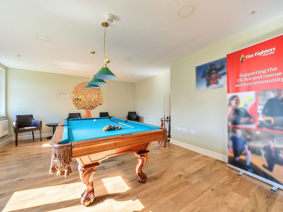 A recreation room with a pool table and seating at Marine Court First-floor Double Bedroom with Wet Room in Littlehampton