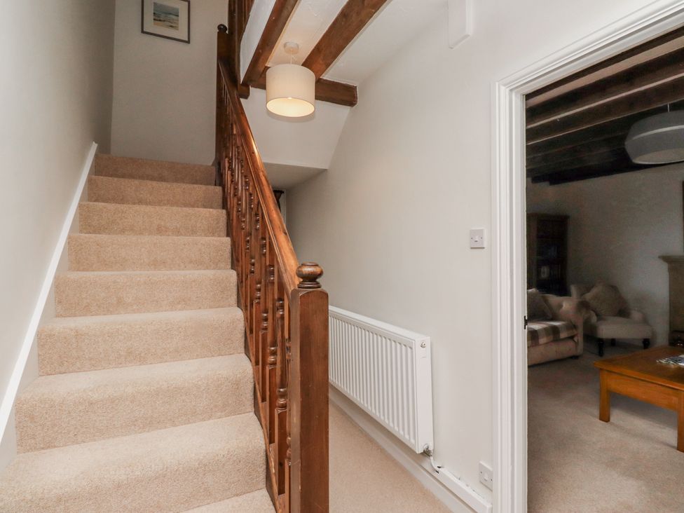A staircase leading to an upper level at 3 Christon Bank Mews Alnwick