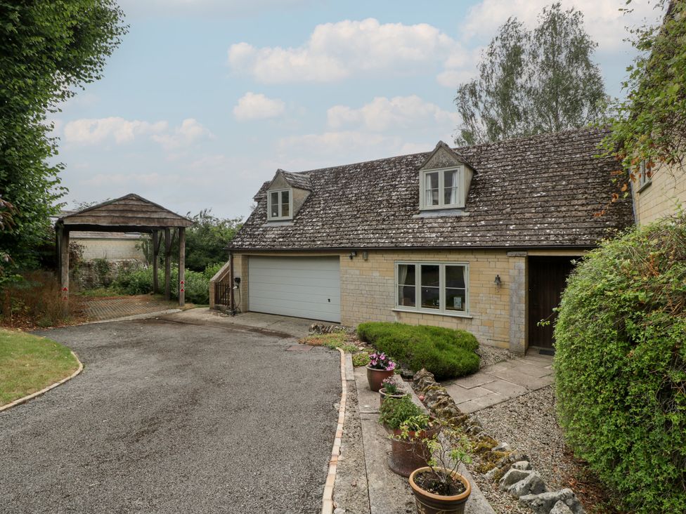 An outdoor area with a house and garage at St. Marys House Church Westcote near Bledington