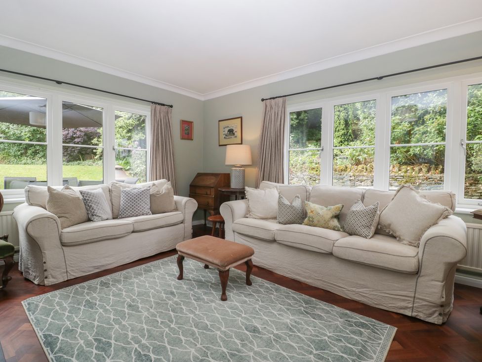 A living room with two sofas and a coffee table at St. Marys House in Church Westcote near Bledington