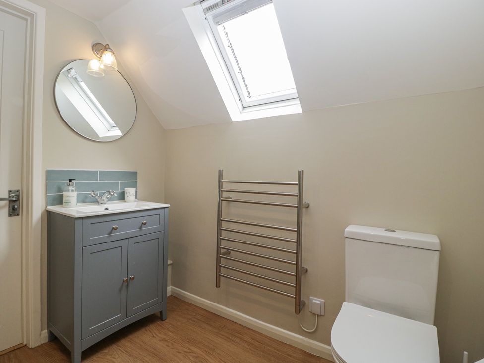 A bathroom with a sink and mirror at St. Marys House in Church Westcote near Bledington