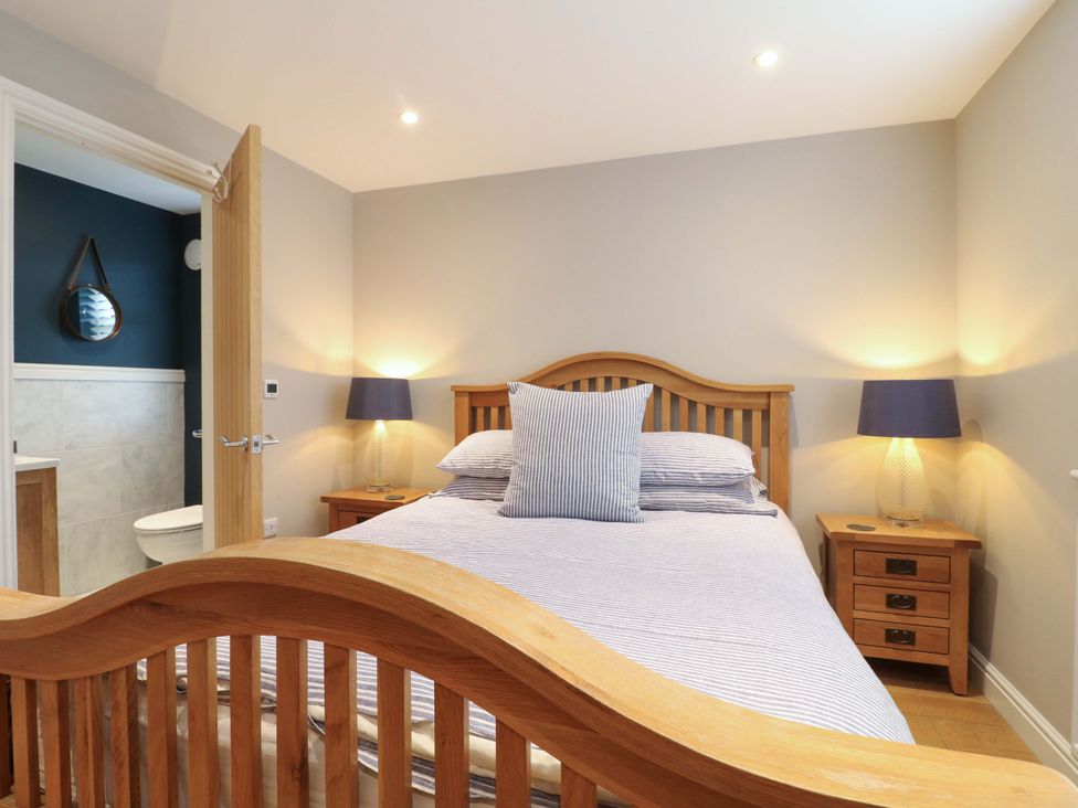 A bedroom with a bed and bedside tables at Farm View House in Somerby