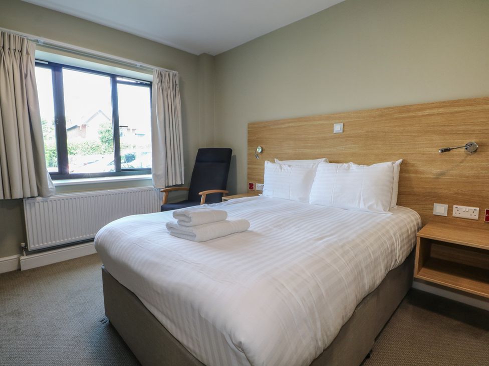 A bedroom with a bed and window at Bedroom 4 in Littlehampton