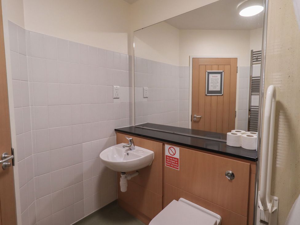 A bathroom with a sink and toilet at Eamont Park First-floor Double Bedroom in Penrith