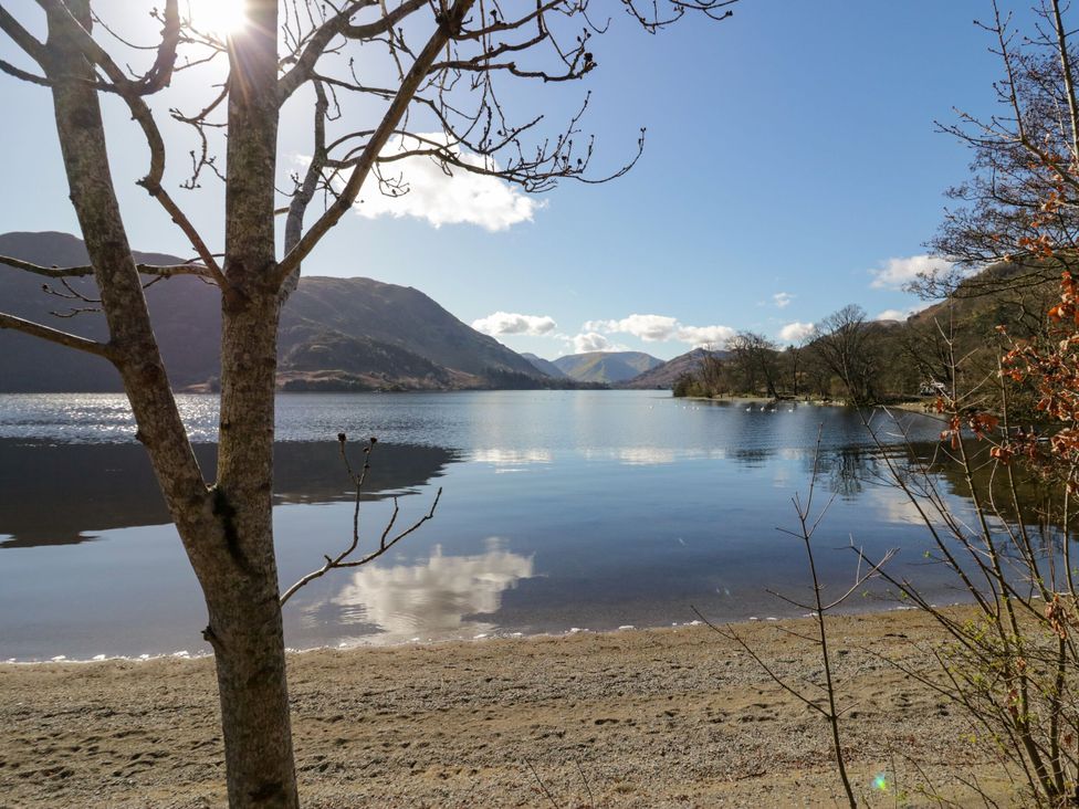 A lake surrounded by mountains and trees at Jubilee First-floor Double Bedroom in Penrith