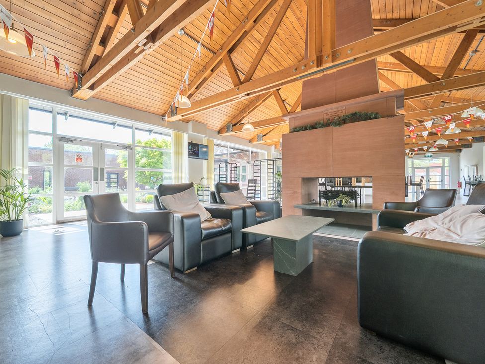 A lounge with seating and a fireplace at Jubilee First-floor Double Bedroom in Penrith