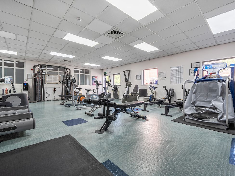A gym with various fitness equipment at Jubilee Two Bedroom Bungalow Pet Free in Penrith