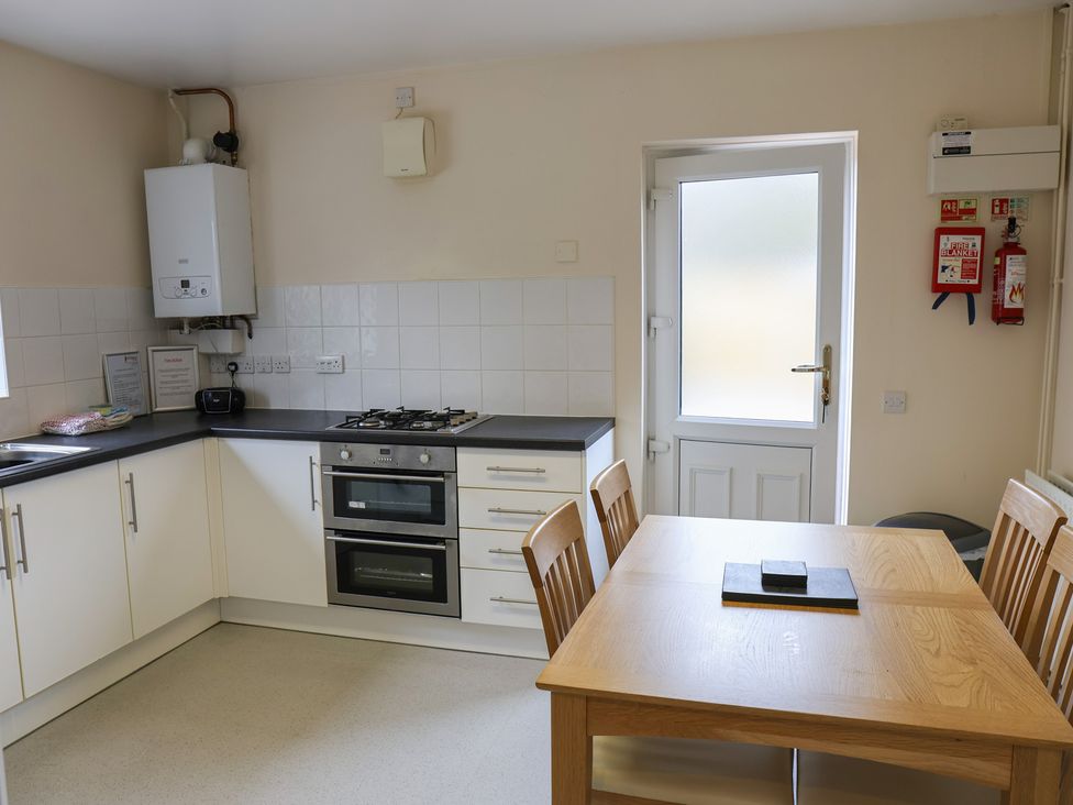 A kitchen with a table and chairs at Bungalow 15 Eamont Park Penrith