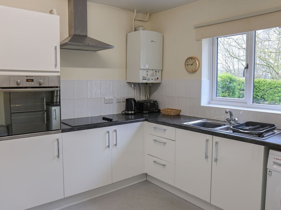 A kitchen with oven, sink and kettle at Bungalow 14 Eamont Park Penrith