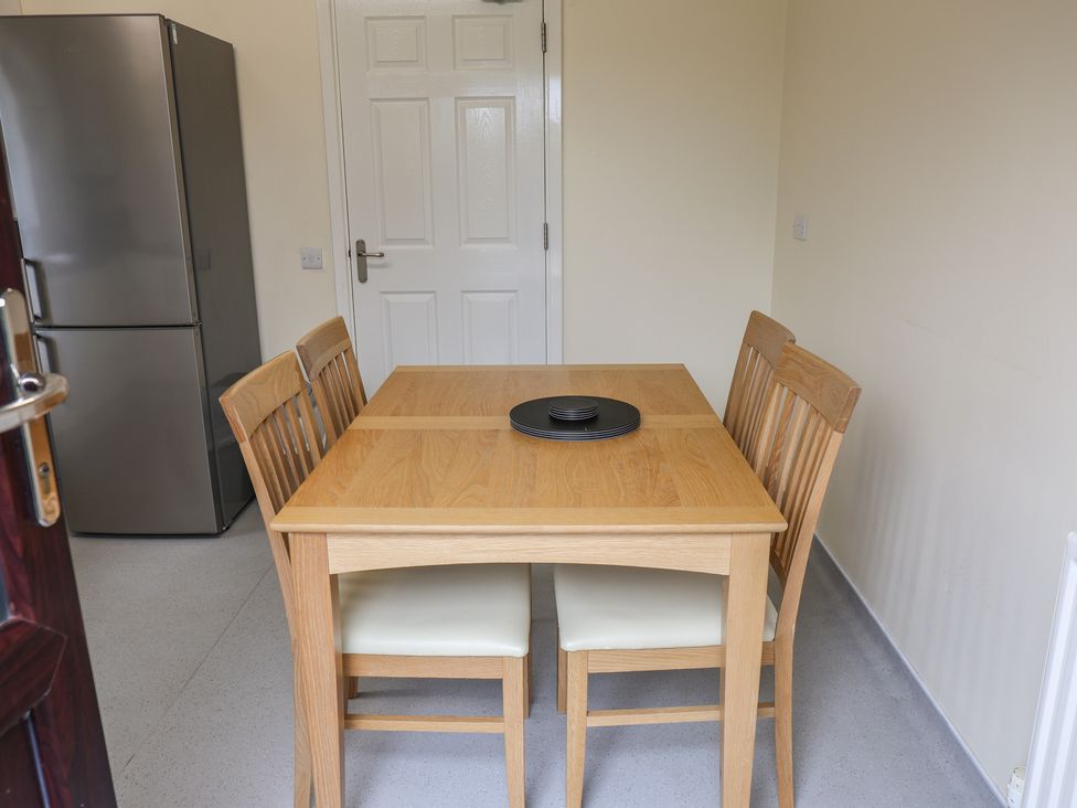 A dining room with table and chairs at Bungalow 14 Eamont Park Penrith