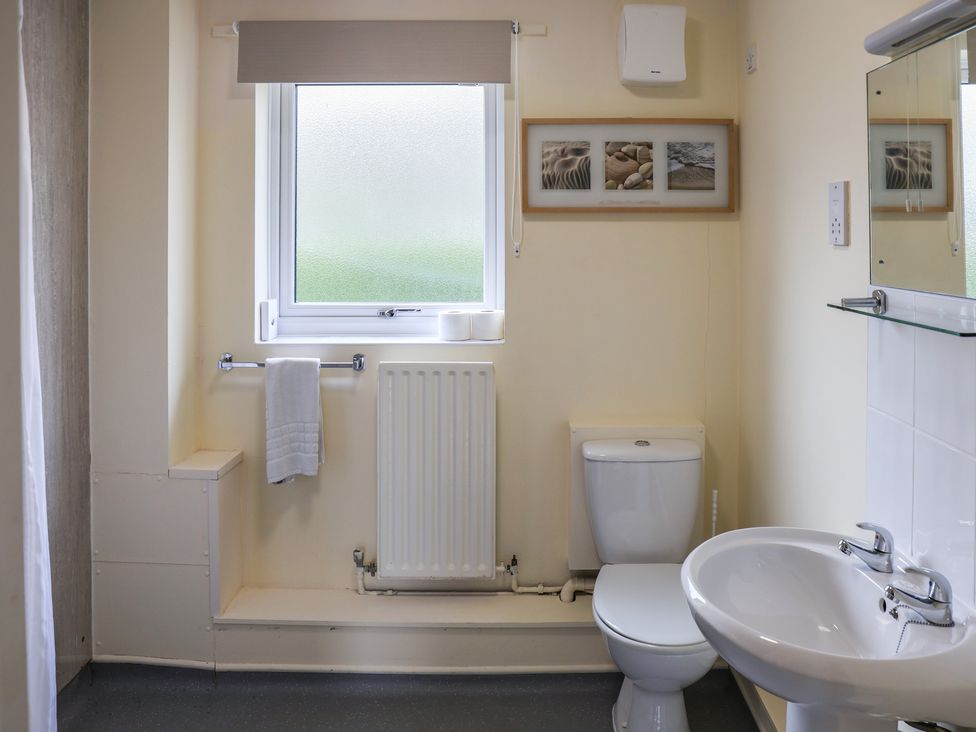 A bathroom with a sink and toilet at Bungalow 14 Eamont Park Penrith