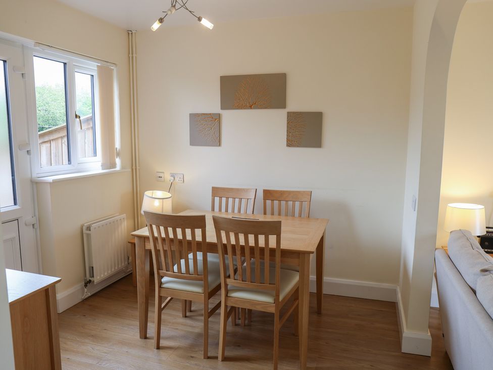 A dining room with a table and chairs at House 8 Eamont Park Penrith