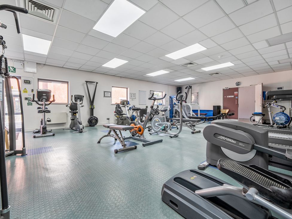 A gym with various exercise equipment at Jubilee Two Bedroom House Pet Free in Penrith