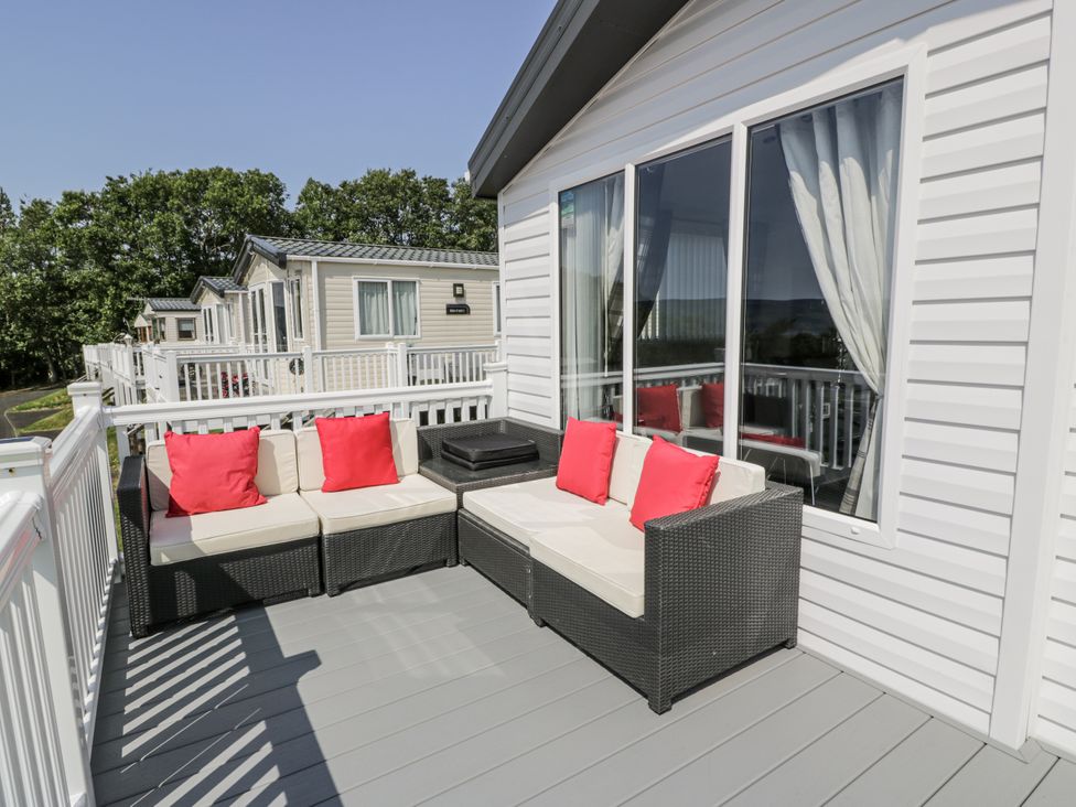 An outdoor seating area with a sofa and table at Number 42 Wemyss Bay