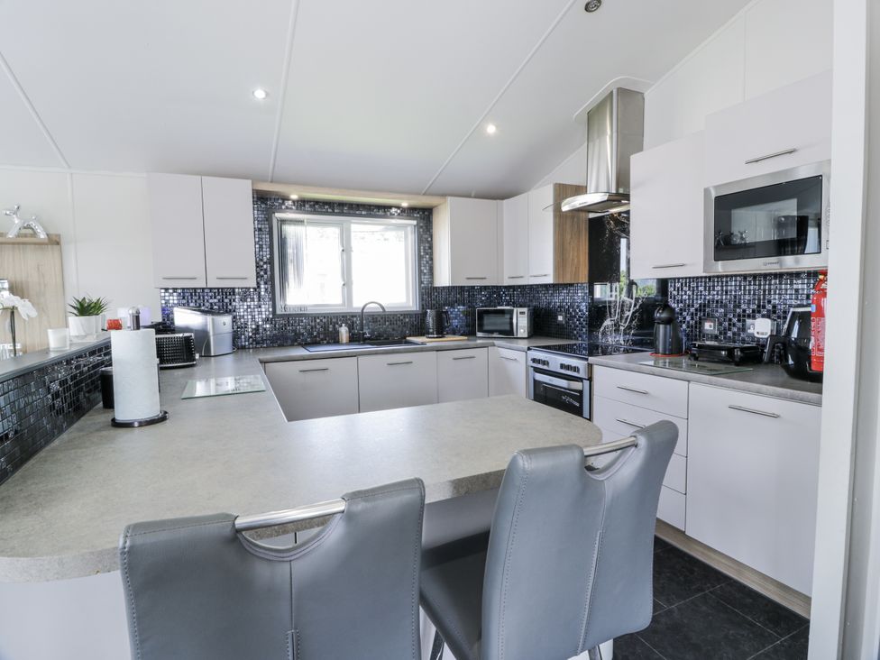 A kitchen with appliances and countertop at Number 42 Wemyss Bay
