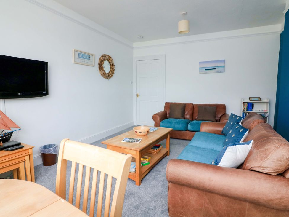 A living room with a television and sofa at Castleview Apartment, 21 South Embankment, Dartmouth