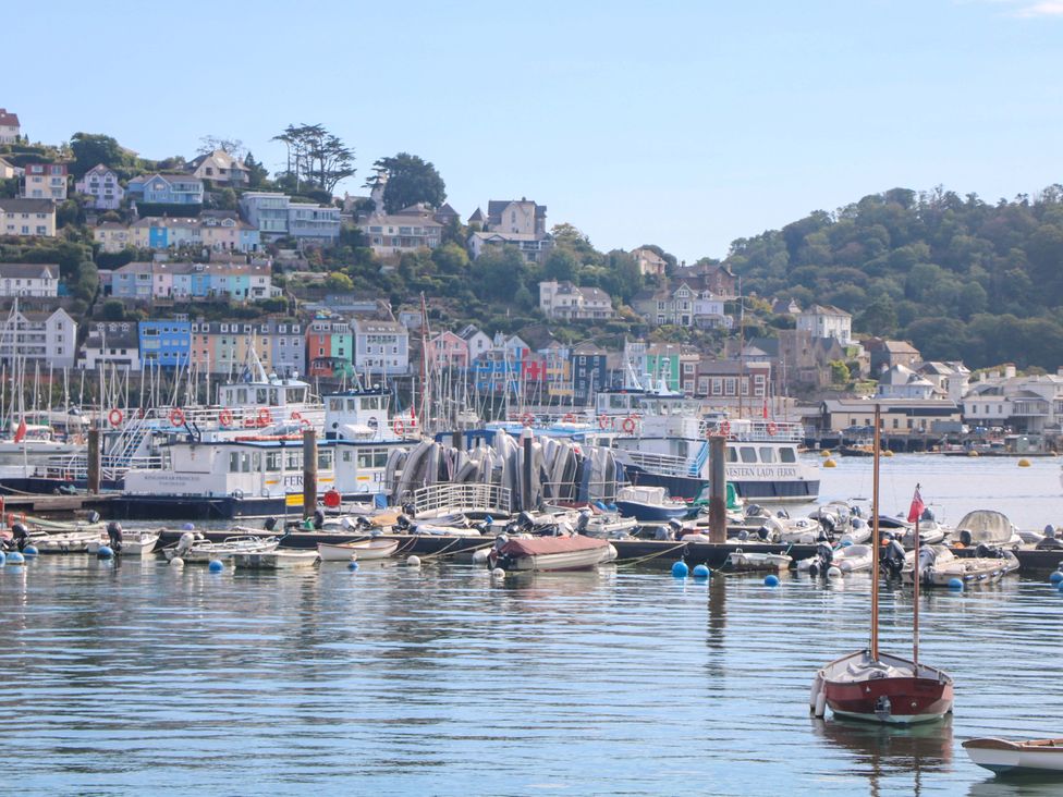 A view of a harbor with boats and homes at Castleview Apartment, 21 South Embankment in Dartmouth