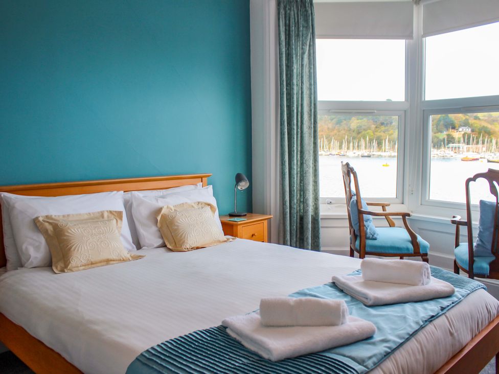 A bedroom with a bed and a view at Castleview Apartment, 21 South Embankment, Dartmouth