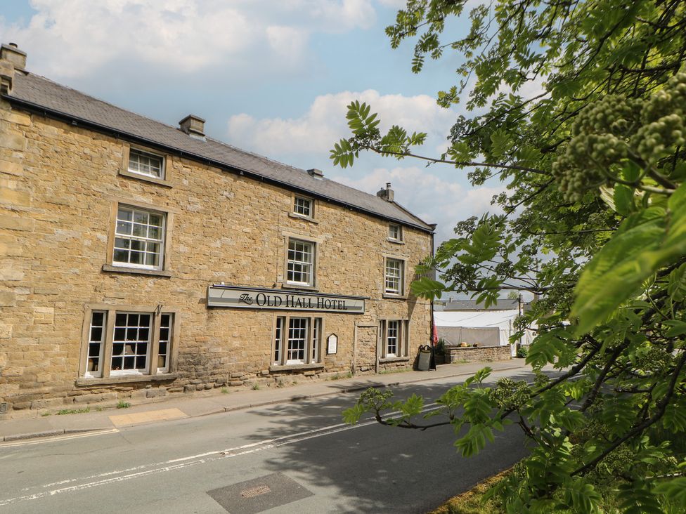 A hotel building with windows and signage at The Old Hall Hotel in Hope Valley