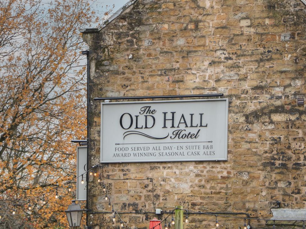 A sign for The Old Hall Hotel with information about services offered in Hope Valley