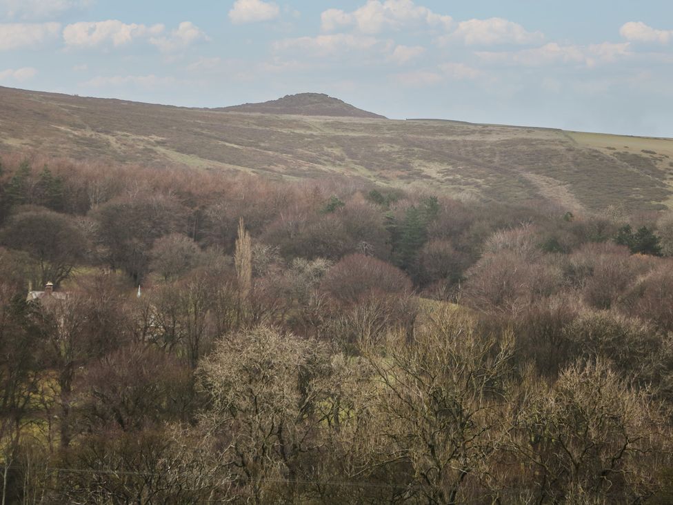 A landscape view of hills and trees at Win Hill View Cottage, Hope Valley