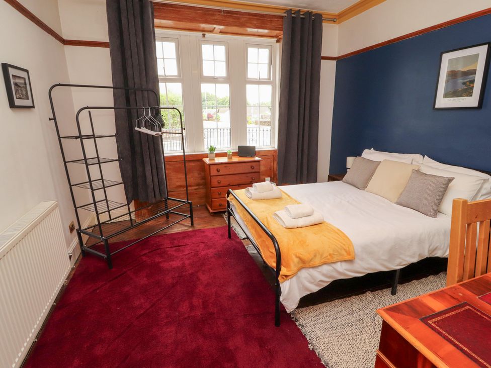 A bedroom with a bed and a chest of drawers at 1 Cleator Gate in Cleator