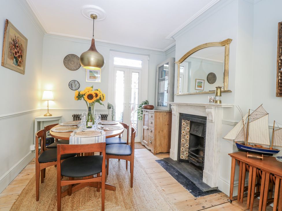A dining room with a table and chairs at 18 Pakefield Road in Lowestoft