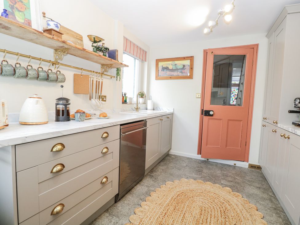 A kitchen with a countertop and cabinets at 18 Pakefield Road in Lowestoft