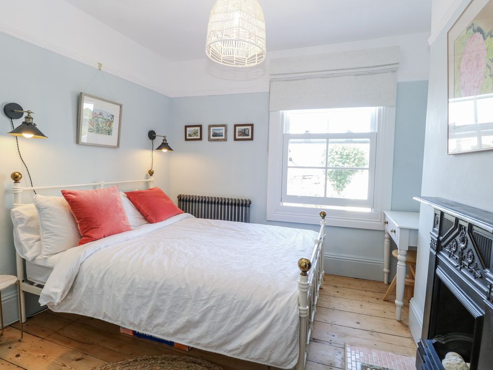 A bedroom with a bed and desk at 18 Pakefield Road Lowestoft
