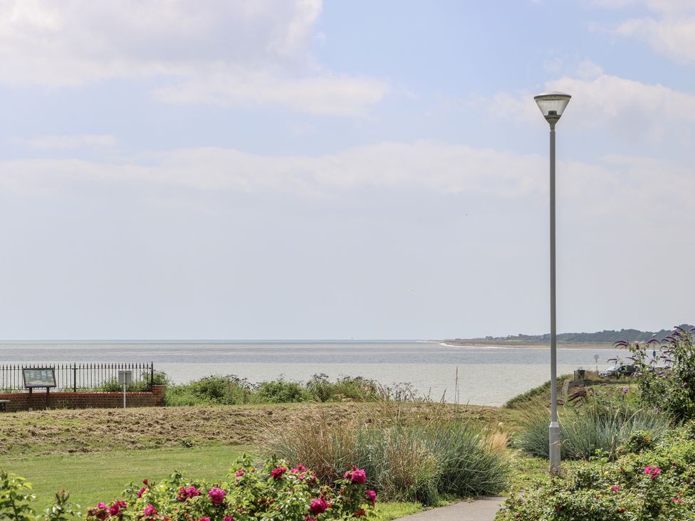 A view of the sea with flowers and a lamp post at 18 Pakefield Road in Lowestoft