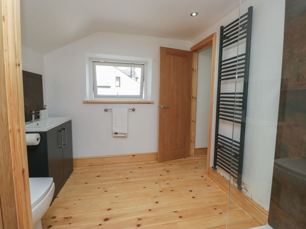 A bathroom with a sink and toilet at Old Post Office Cottage in Ulverston