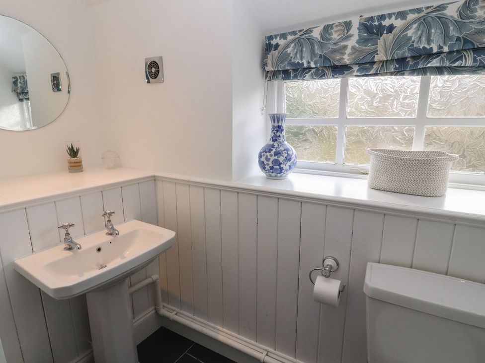 A bathroom with a wash basin and toilet at Deer How Farm in Patterdale near Glenridding