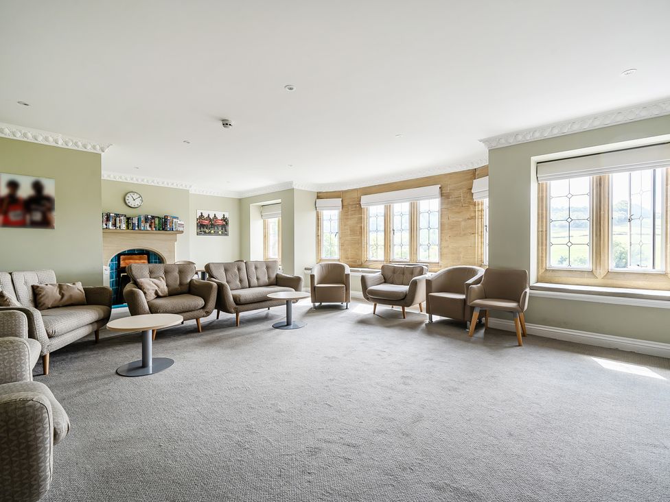 A living room with sofas and armchairs at Harcombe House Accessible Pet Free Bungalow Sleeps 6 in Chudleigh