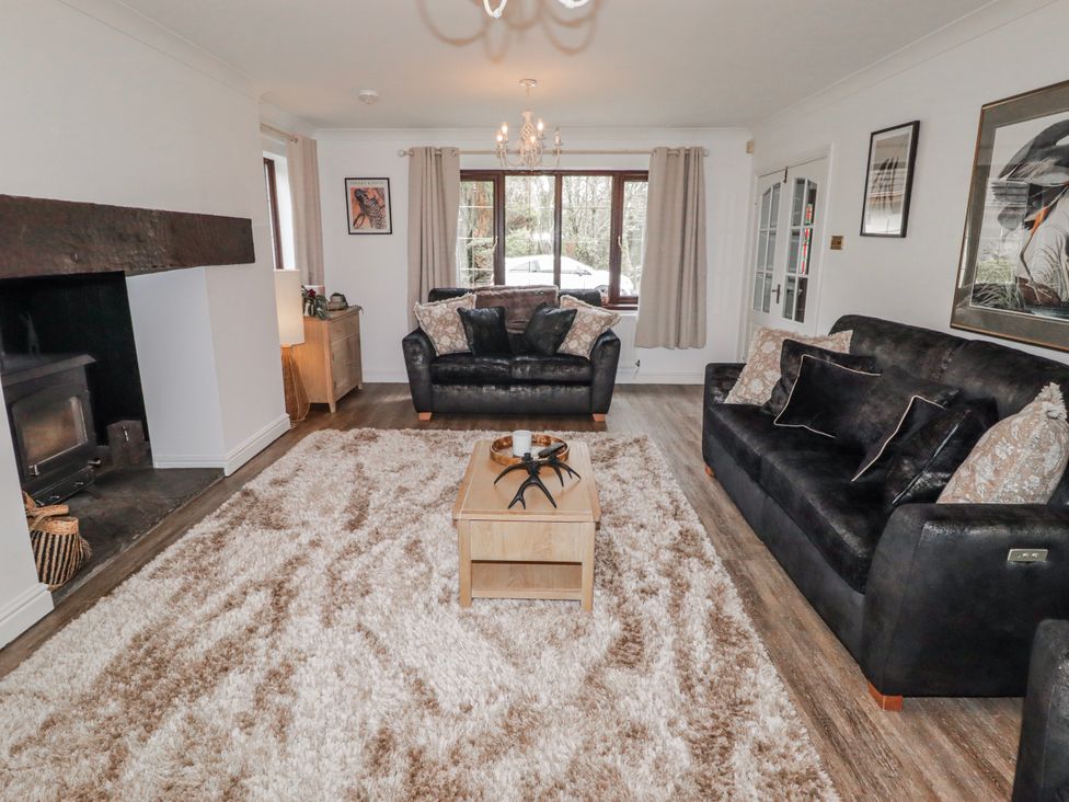 A living room with two sofas and a coffee table at Carreg Llwyd Groeswen near Trecenydd