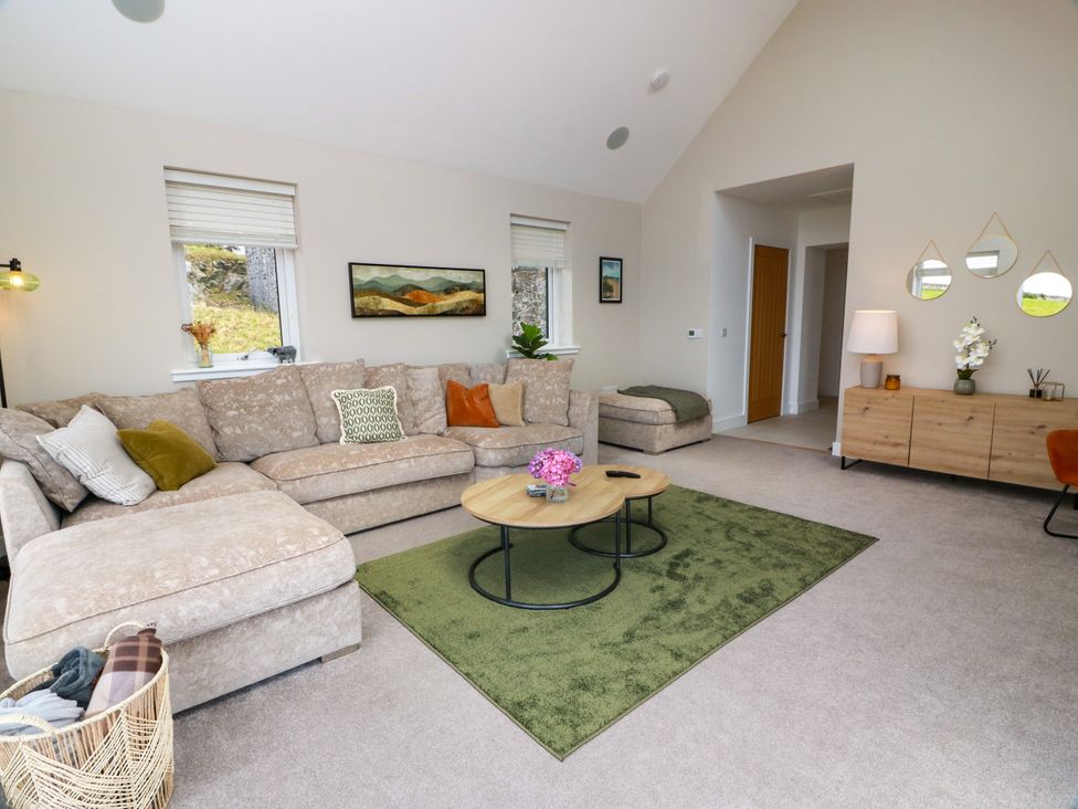 A living room with a sofa and coffee table at Balcarry Barn in Glenluce