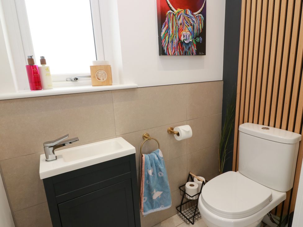 A bathroom with a sink and toilet at Balcarry Barn in Glenluce