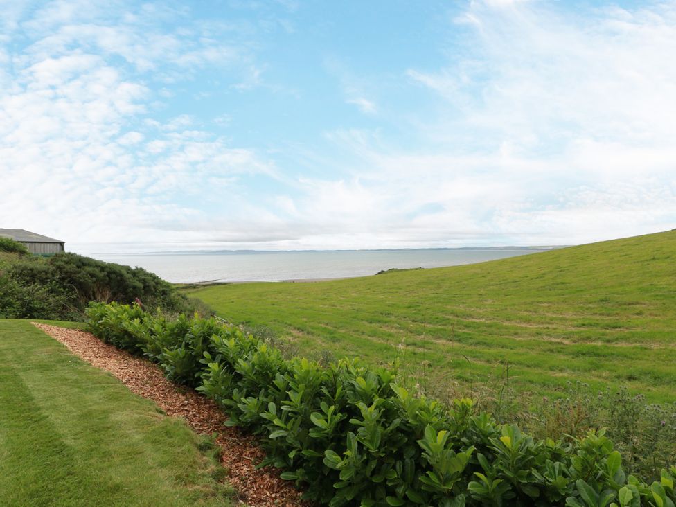 A view of the sea and grass landscape at Balcarry Barn in Glenluce