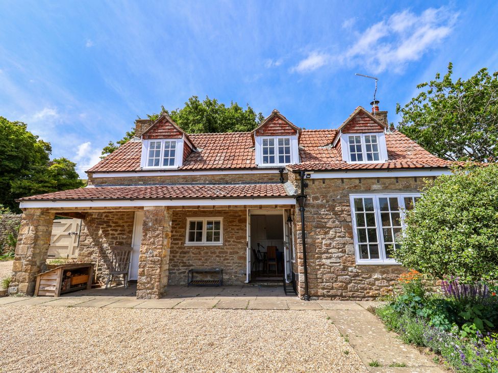 A house with windows and door in the yard at Tithe Barn Cottage Litton Cheney near Burton Bradstock