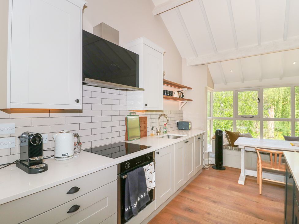 A kitchen with cabinets and appliances at Cleveley Mill in Enstone