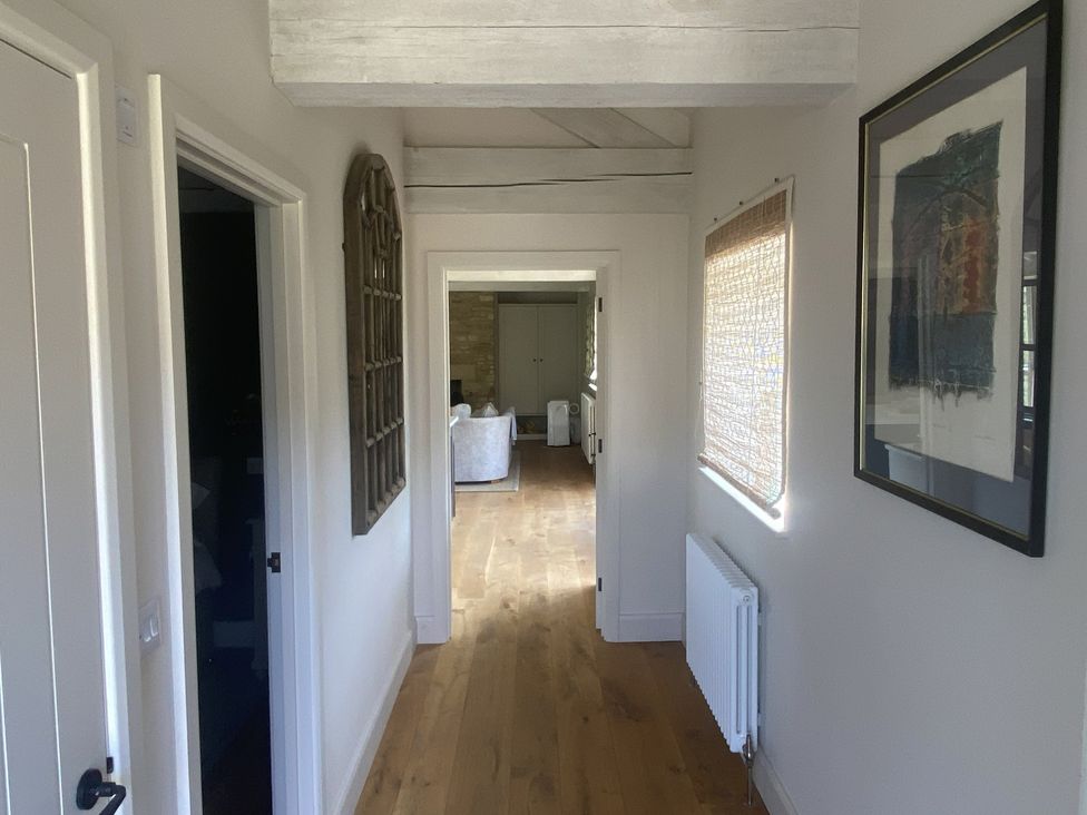 A hallway with doors and a window at The Annexe, Cleveley Mill, Enstone