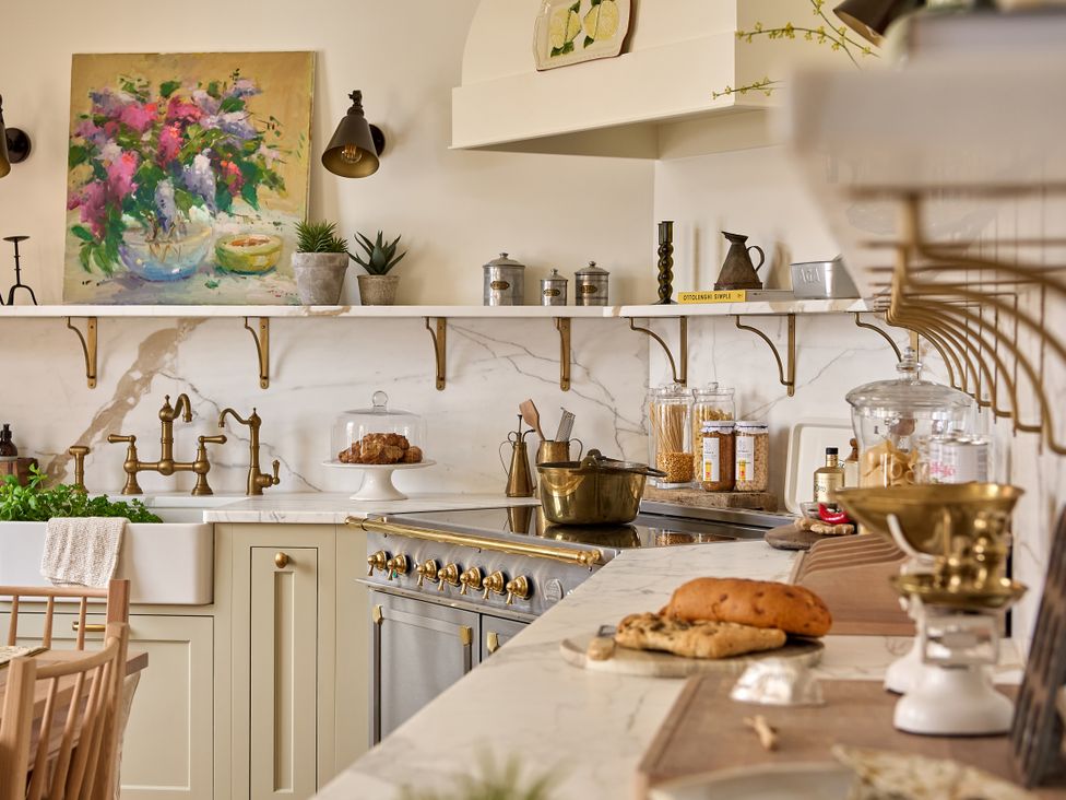 A kitchen with a sink, oven, and shelves at Castle Corner, The Georgian House, Ludlow