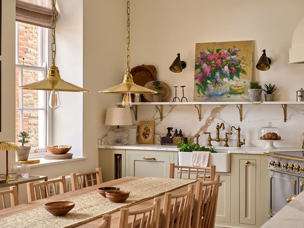 A kitchen with a dining table and chairs at Castle Corner, The Georgian House, Ludlow