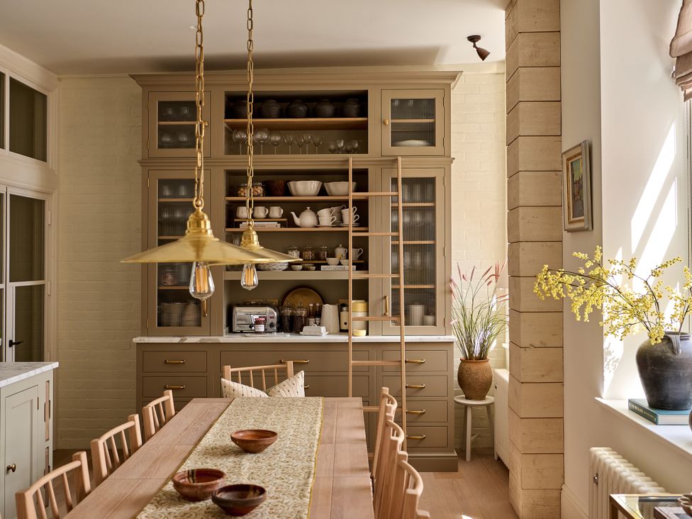A kitchen with a wooden table and chairs at Castle Corner, The Georgian House, Ludlow