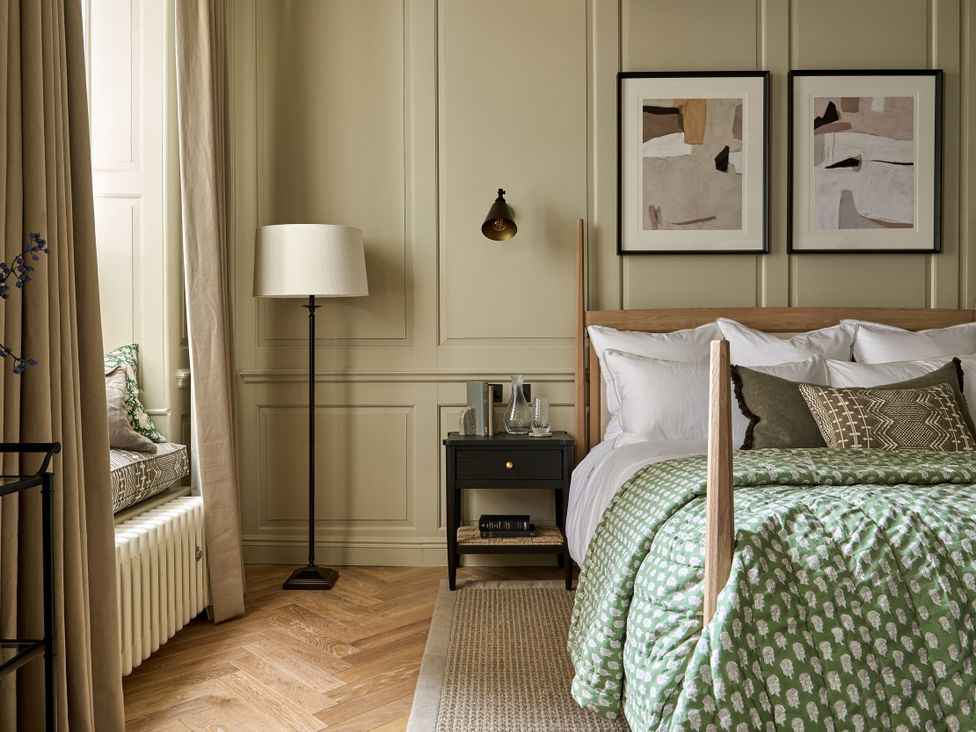 A bedroom with a bed and bedside table at Castle Corner, The Georgian House, Ludlow