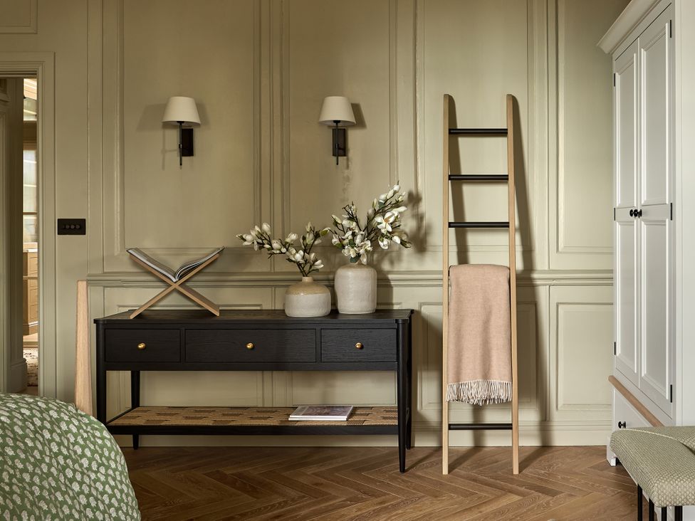 A bedroom with a console table and ladder at Castle Corner, The Georgian House, Ludlow